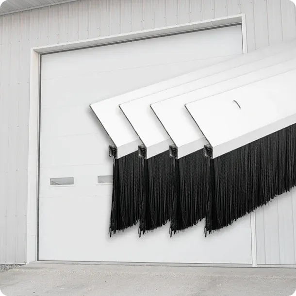 Four white garage door brush seal strips with black bristles shown in front of a closed white overhead door