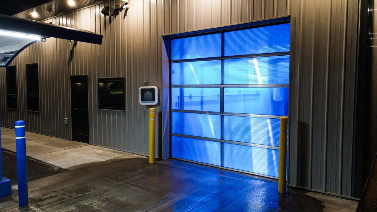 Wide exterior view of the Northdale Car Wash building and bay opening
