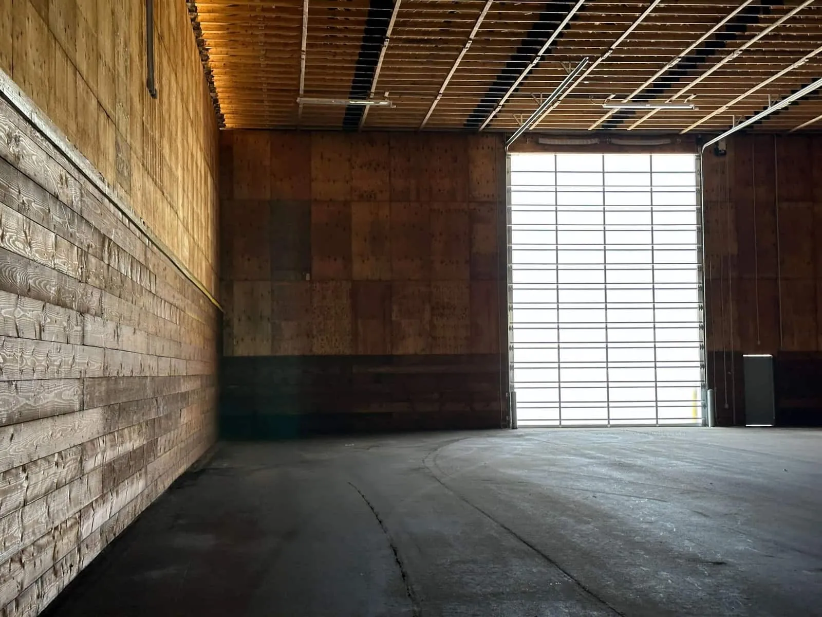 Salt storage building with an overhead door sized for loader traffic