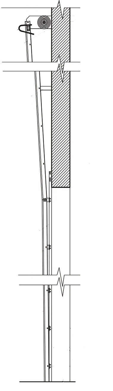 Shop-drawing elevation of vertical lift track with a heavy duty headplate, showing the upper track angled slightly off the wall with intermediate support brackets
