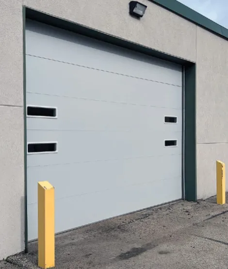White insulated washbay door with a row of window lites